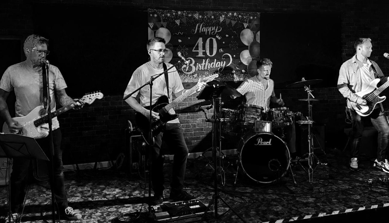 Full band playing on stage