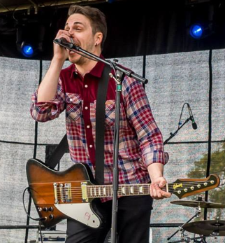 Chris singing on stage