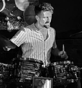 Rhys playing drums